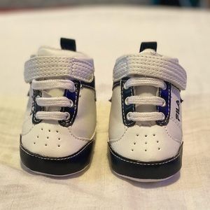 White and black Fila baby shoes